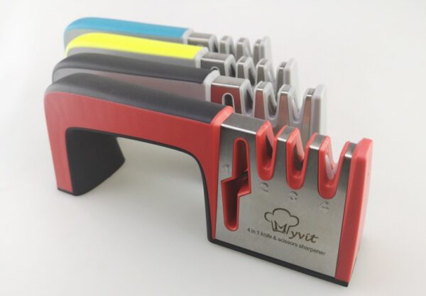 A Four-in-one Family Uses A Sharpener To Sharpen A Kitchen Knife - Image 3